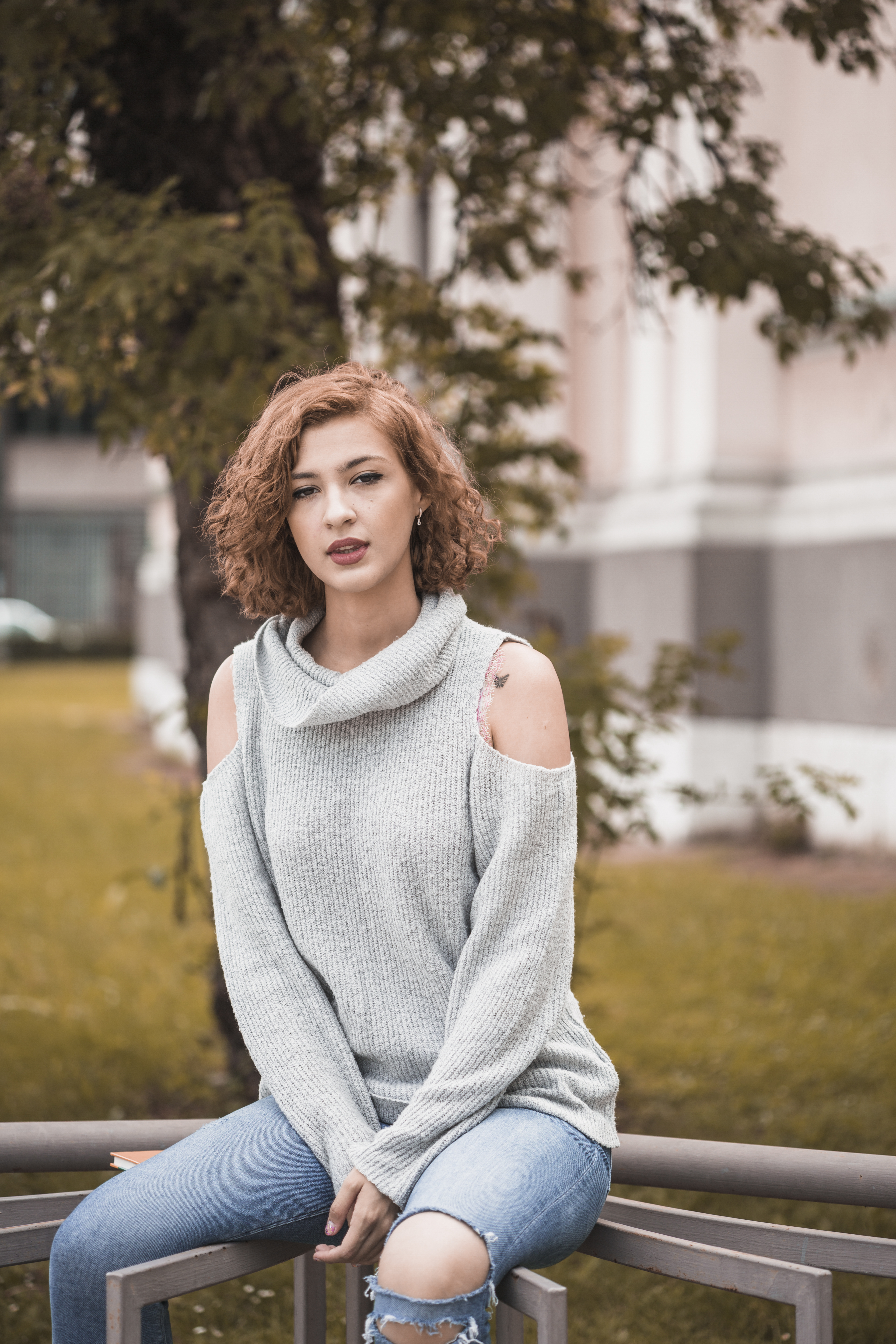 attractive-lady-sitting-rail.jpg