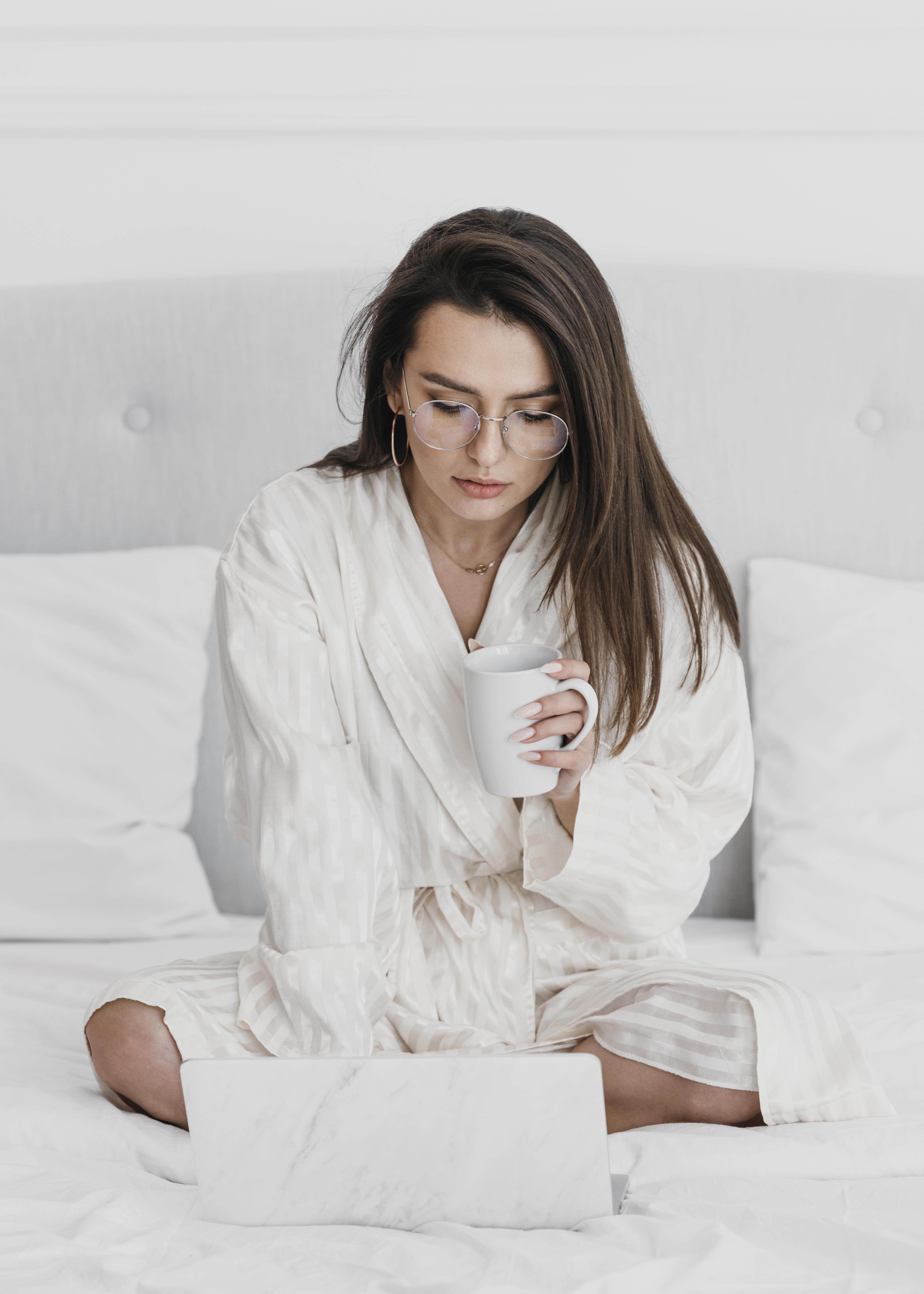 full-shot-woman-with-cup-laptop.jpg