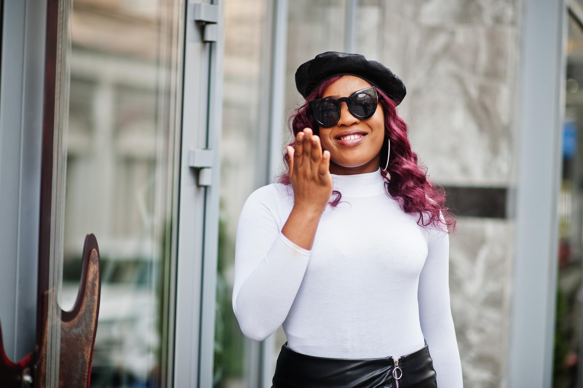 big-mama-plus-size-african-american-model-black-sunglasses-beret-leather-skirt-posed-outdoor-send-air-kiss_627829-6972.jpg