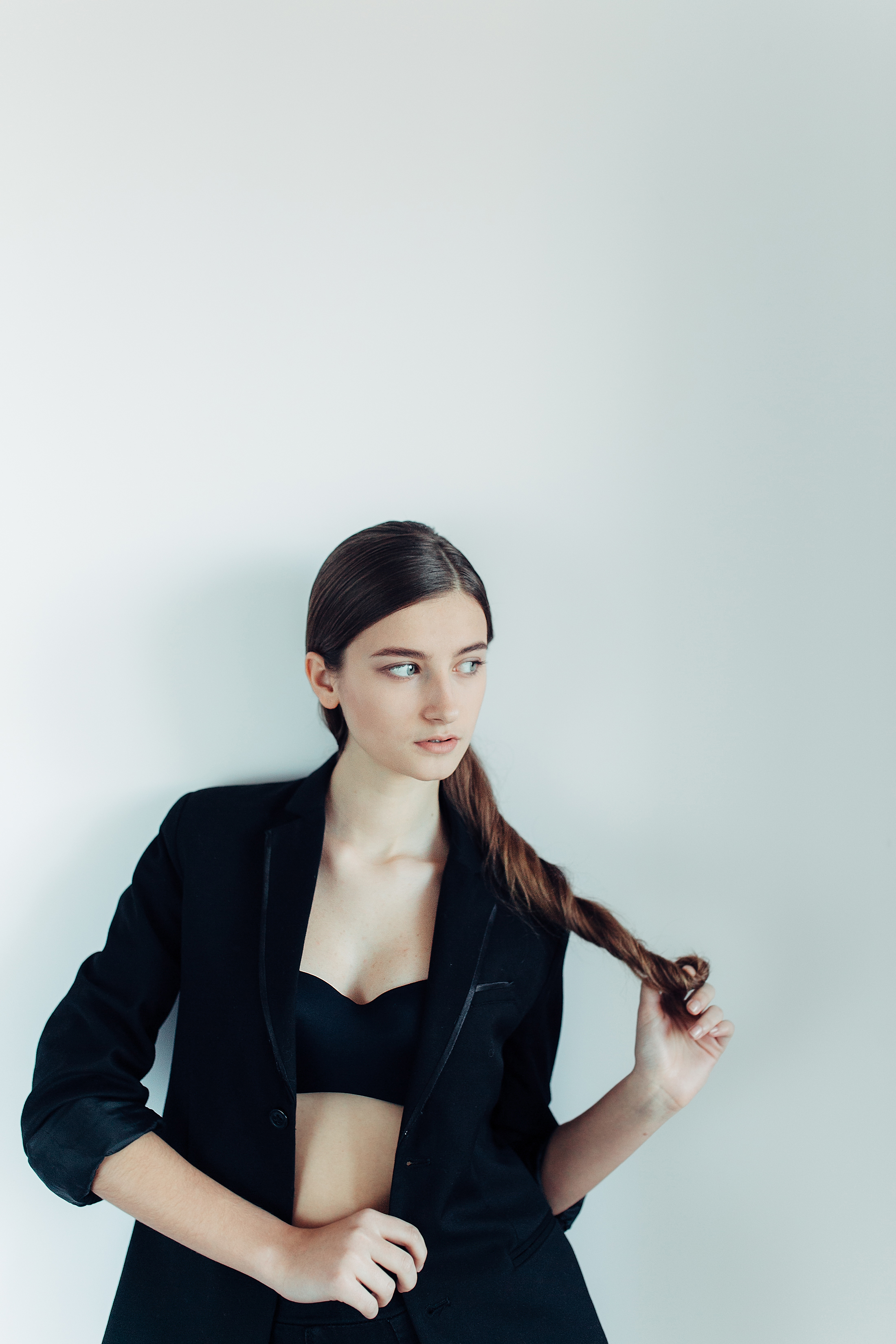 young-beautiful-woman-posing-white-wall (2).jpg